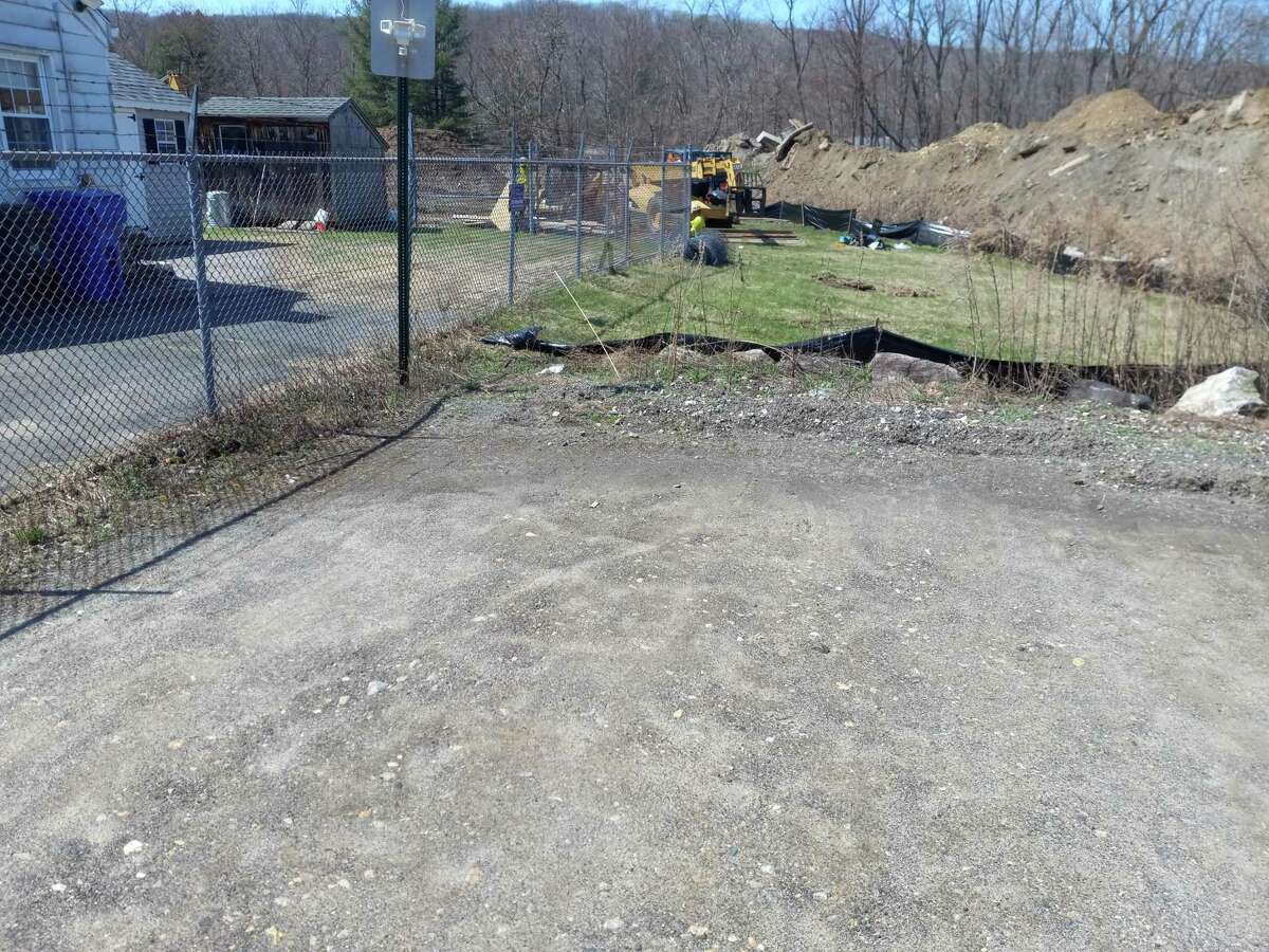 Workers clear the ground for Torrington's new animal control facility, which will replace the small and aging facility with a state-of-the-art building.