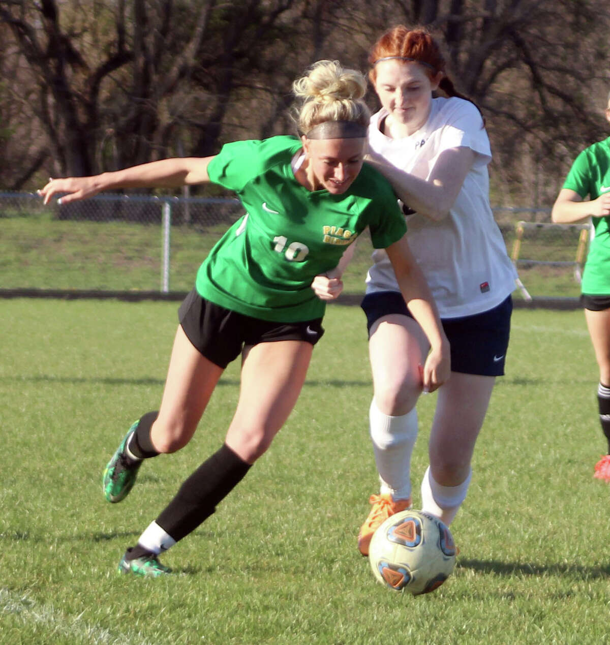 Morgan Durham of Southwestern (10) scored a pair of goals Friday and helped lead the Piasa Birds to a 4-0 victory over Auburn. She is shown in action earlier this season against Pana.