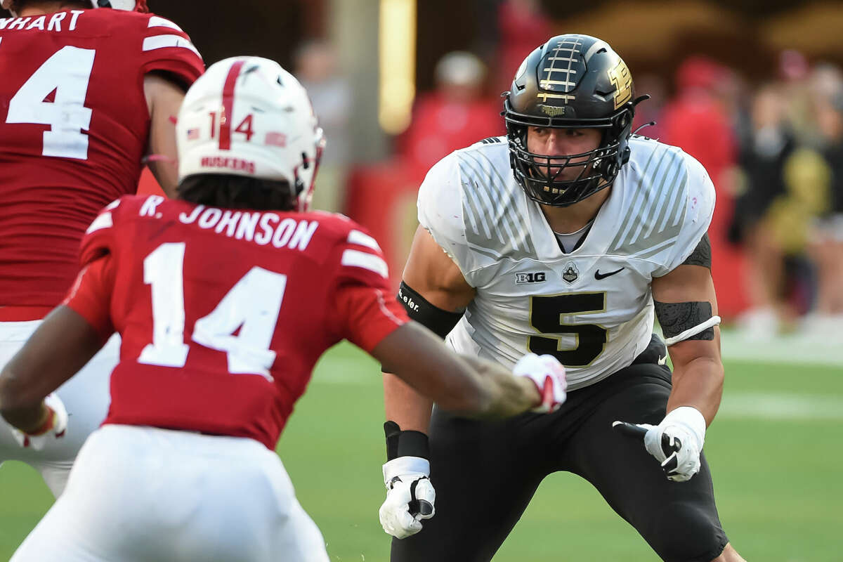 LINCOLN, NE - OCTOBER 30: Defensive end George Karlaftis #5 of the Purdue Boilermakers prepares to rush against running back Rahmir Johnson #14 of the Nebraska Cornhuskers in the second half at Memorial Stadium on October 30, 2021 in Lincoln, Nebraska. (Photo by Steven Branscombe/Getty Images)