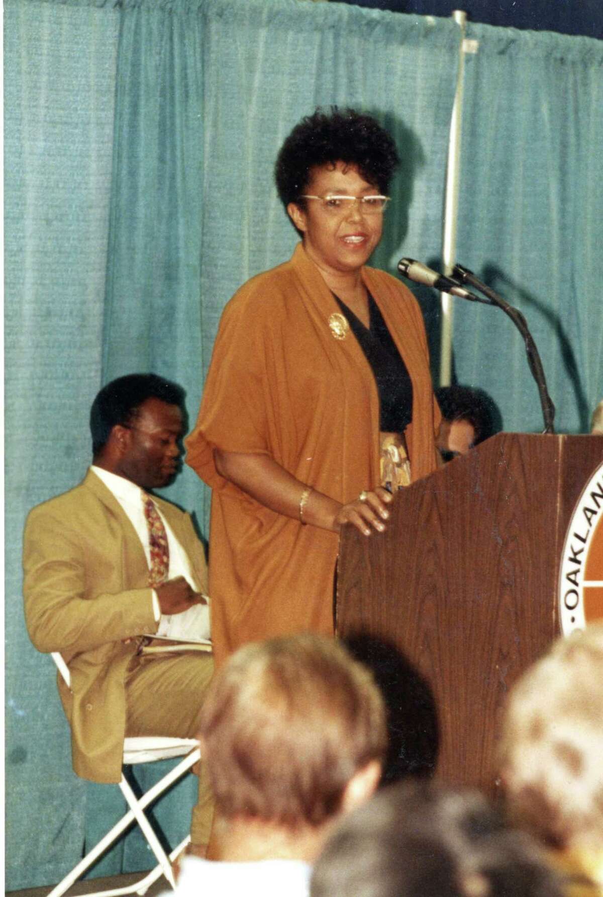 Sharon Jones speaks at a conference held at the Oakland Coliseum. Date unknown.