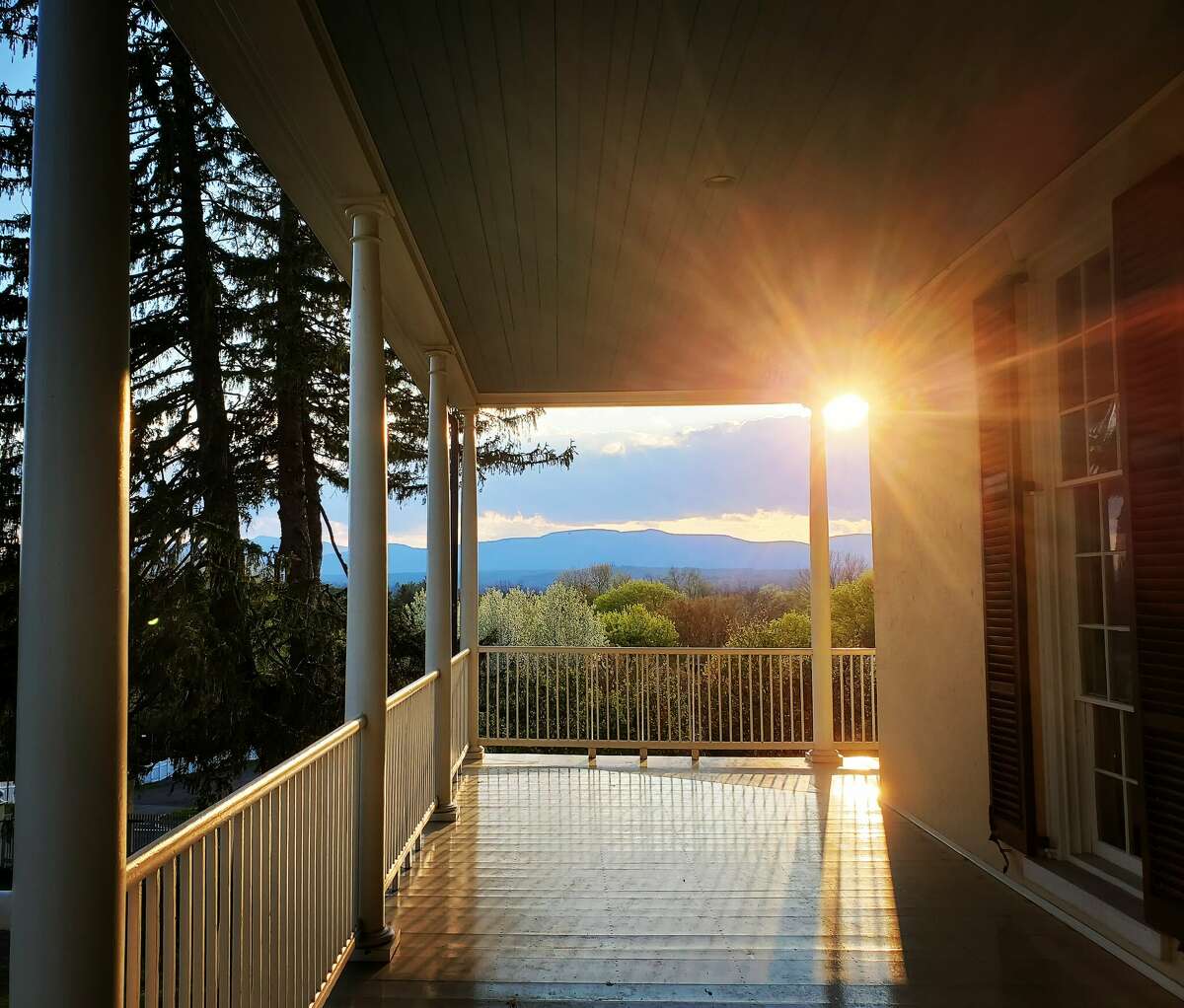 The porch at the Thomas Cole Historic Site in Catskill, with views of the Catskill Mountains. The natural world inspired landscape painter Thomas Cole.