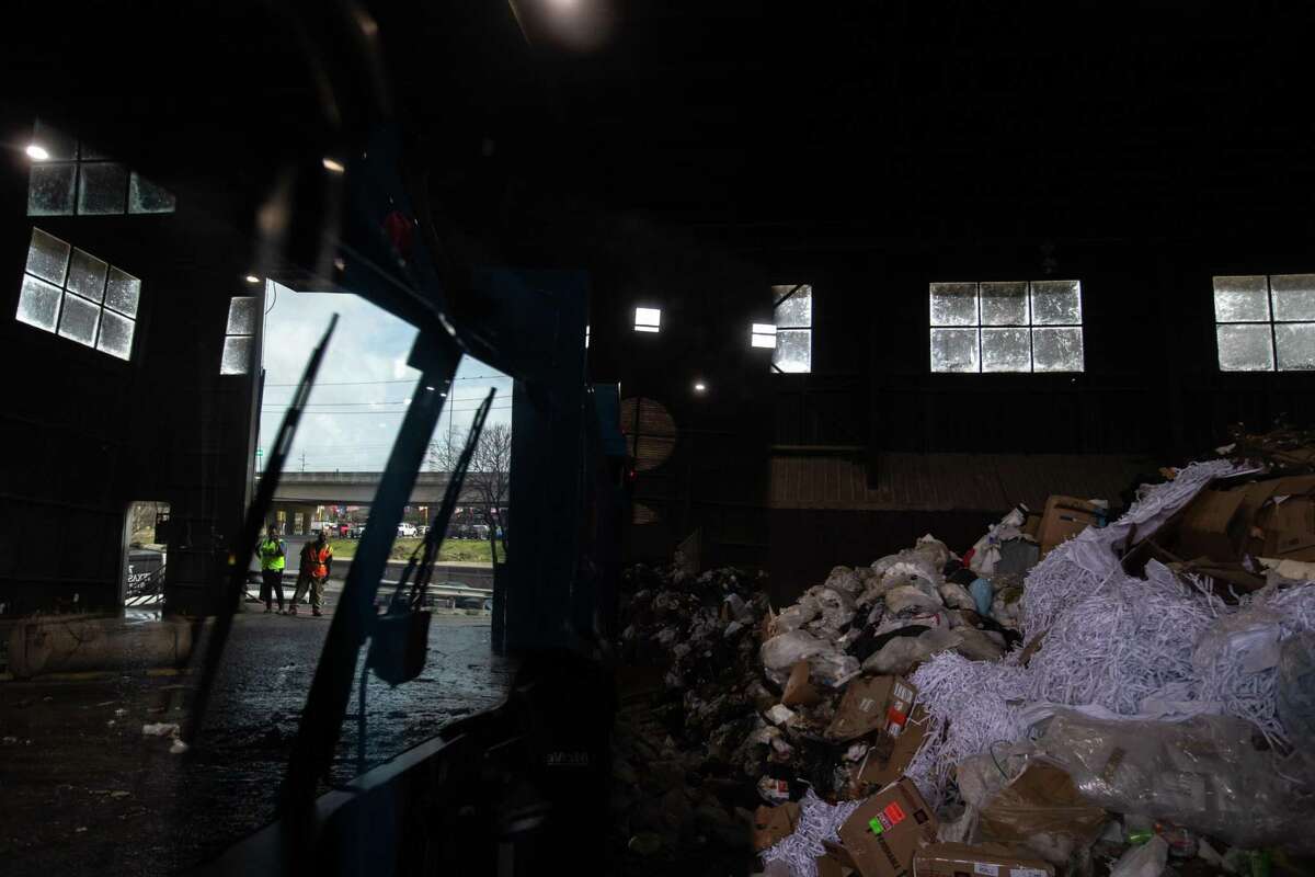 Trash at a waste transfer station, Tuesday, March 29, 2022, in Houston.
