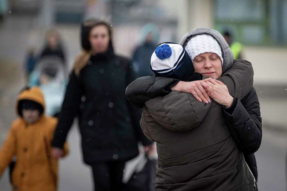 Refugees fleeing Ukraine reunite at the border crossing in Medyka, Poland, last month. Poland has embraced Ukrainian refugees, and, no, it has not been an economic burden.