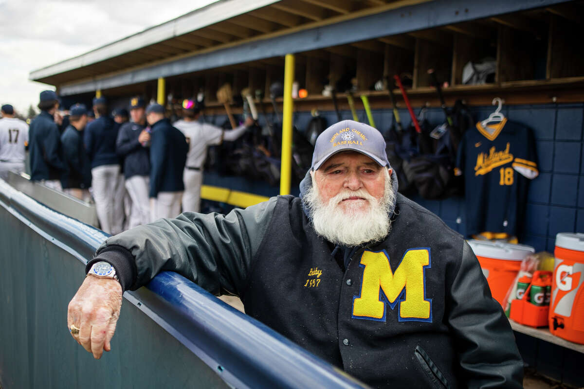 Bobby Lanning, a graduate in the Midland High School class of 1957, sits in the dugout while keeping score during a Midland High School baseball game Thursday, April 14, 2022 in Midland. Lanning is a Chemics "superfan," who serves as the official scorekeeper at many Midland High athletics events.