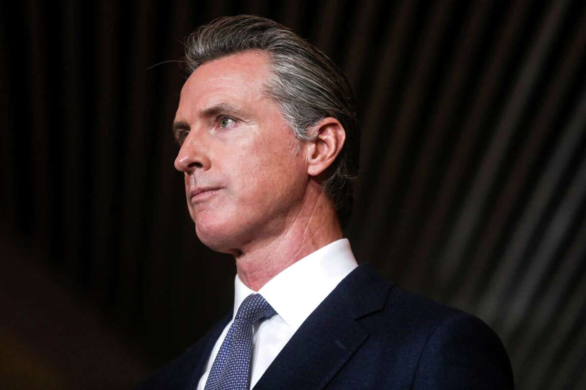 Gov. Gavin Newsom announces new state actions to protect Californians amid rising cases of COVID-19 and the new Omicron variant during a press conference at the Native American Health Center in Oakland, Calif. on Dec. 22, 2021.