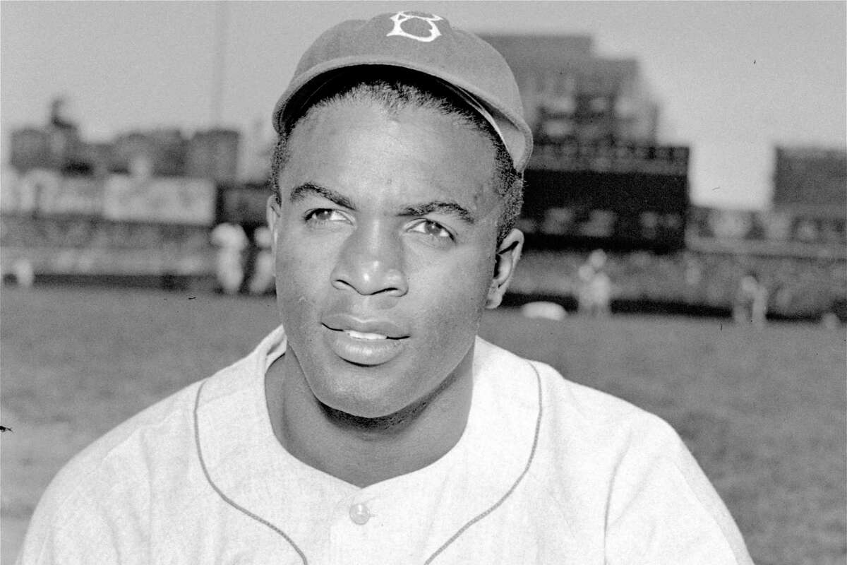 FILE - This is an April 18, 1948, portrait of Brooklyn Dodgers baseball player Jackie Robinson. It's Jackie Robinson Day across the big leagues on Friday, Aug. 28, 2020, as baseball honors the man who broke the sport's color barrier in 1947. (AP Photo/File)