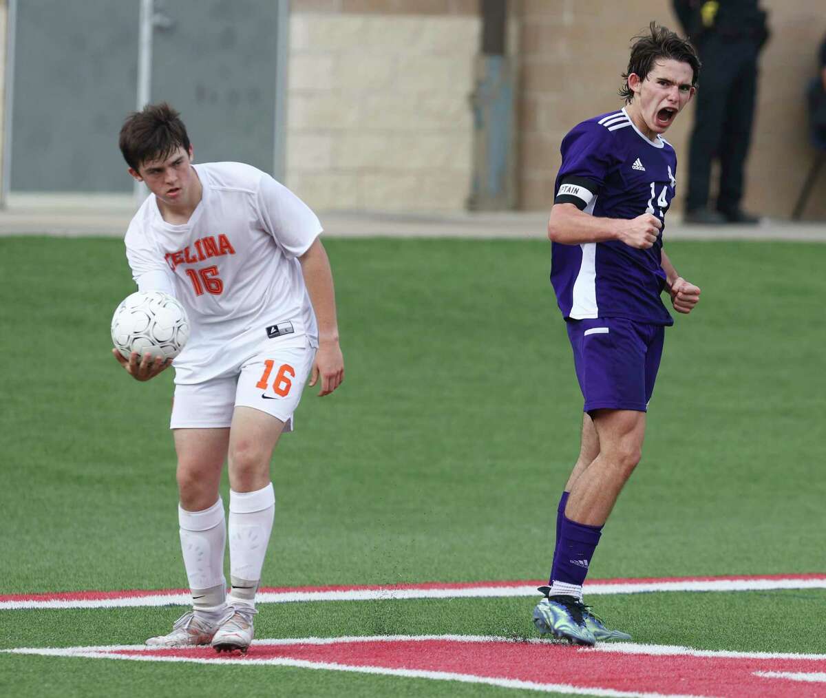 Boerne Greyhounds' Sam Theiss (14) reacts after Celina Bobcats' Nikolas Hamblin (16) gets called for a penalty which set up a penalty kick for Boerne in the first overtime in the Class 4A soccer state championship game in Georgetown on Friday, Apr. 15, 2022. Boerne scored on that penalty kick and helped Boerne defeat Celina, 2-1, in overtime to win their second and back-to-back state title.