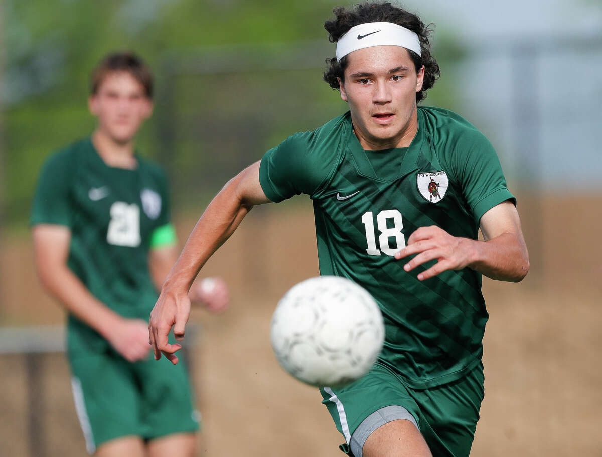 The Woodlands defender Alexander Angelkov (18) chases down the ball in the first half of a Class 6A boys state semifinal match during the UIL State Soccer Championships, Friday, April 15, 2022, in Georgetown.
