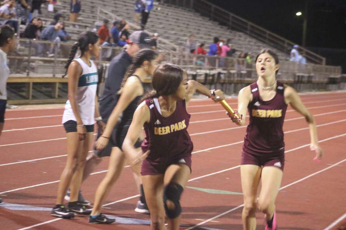 It's another smooth handoff of the baton Thursday night for two of Deer Park's 4 by 400 squad. that won the district title with the time of 4:15.85.