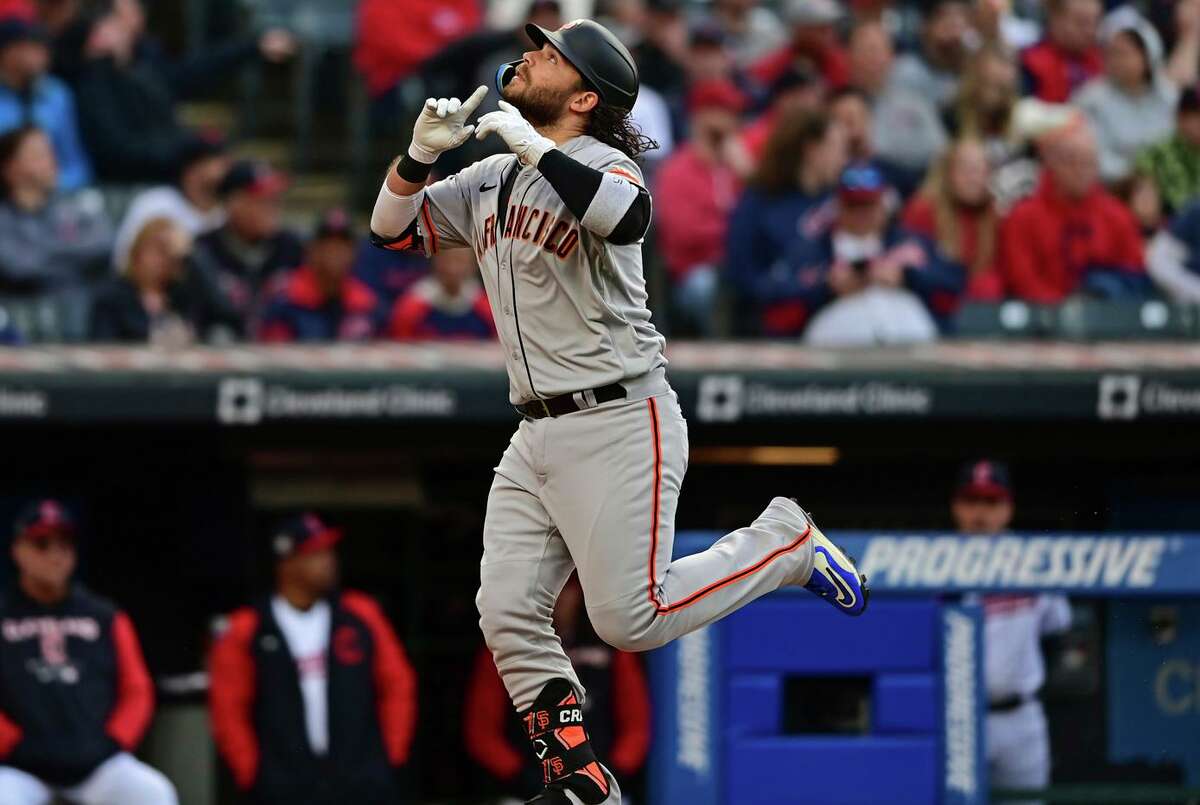 Giants shortstop Brandon Crawford celebrates after hitting a solo home run off Guardians starting pitcher Zach Plesac in the second inning in Cleveland.