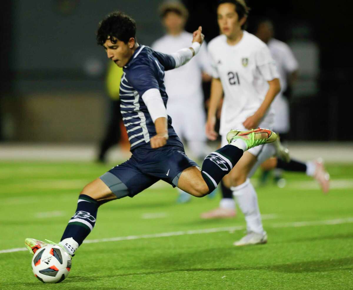 College Park’s AJ Vera takes a shot on goal in the first period of a District 13-6A high school soccer match at Woodforest Bank Stadium, Tuesday, March 8, 2022, in Shenandoah.