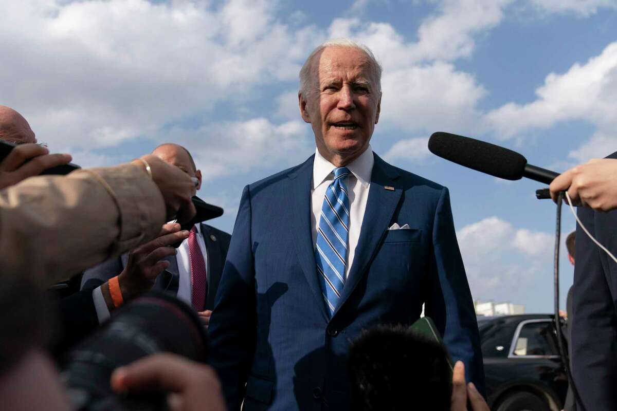 President Joe Biden speaks to the media before boarding Air Force One at Des Moines International Airport, in Iowa, April 12, 2022, en route to Washington. Biden said Russia’s war in Ukraine amounted to a “genocide,” accusing President Vladimir Putin of trying to “wipe out the idea of even being a Ukrainian.”