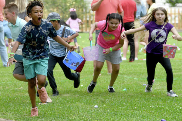 Children fanned out like buckshot at the event start during the annual Easter Egg Hunt at the John Jay French House Museum Saturday. The popular family event made a return after a two-year cancelation due to the pandemic. Photo made Saturday April 16, 2022. Kim Brent/The Enterprise