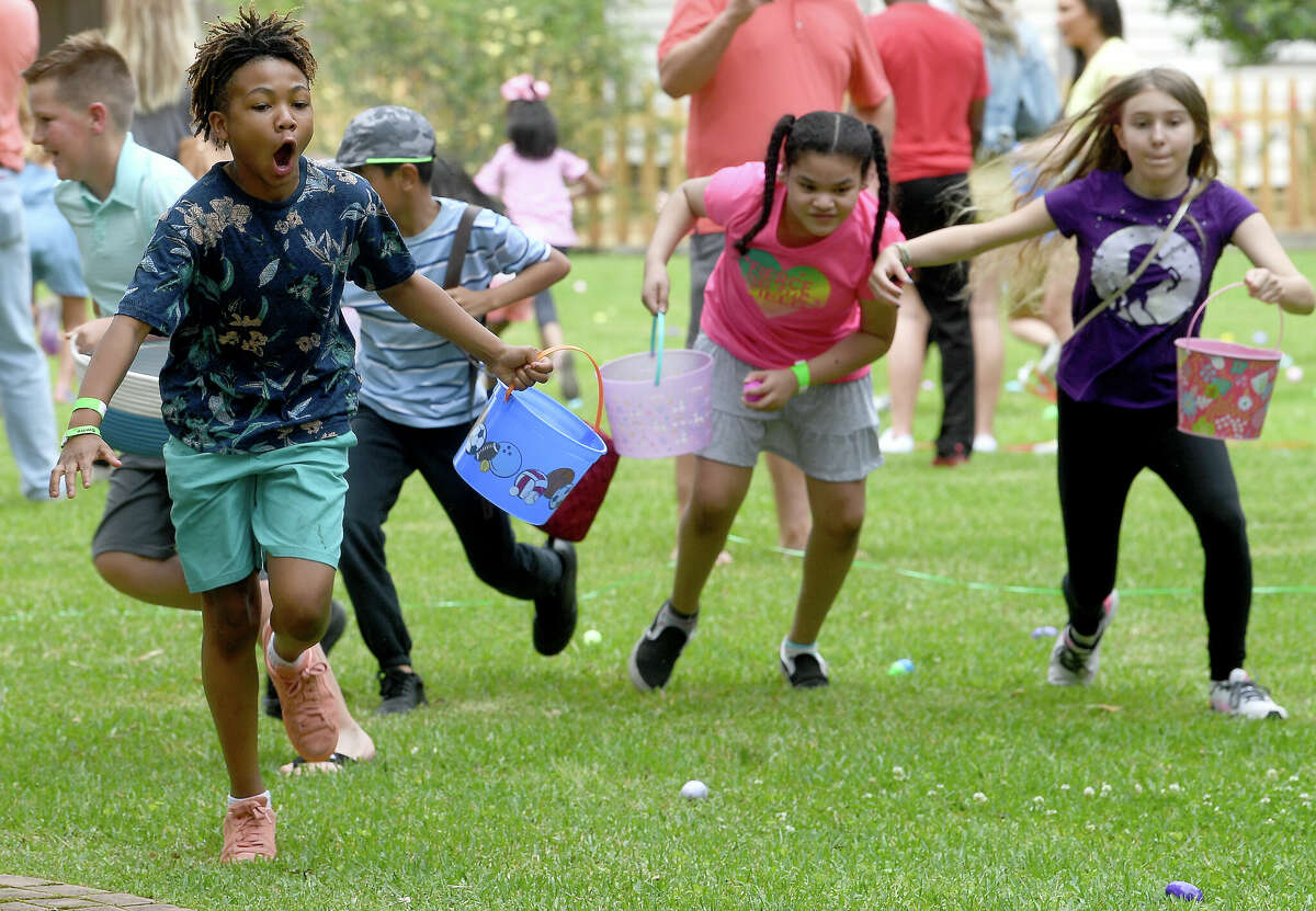 Children fanned out like buckshot at the event start during the annual Easter Egg Hunt at the John Jay French House Museum Saturday. The popular family event made a return after a two-year cancelation due to the pandemic. Photo made Saturday April 16, 2022. Kim Brent/The Enterprise
