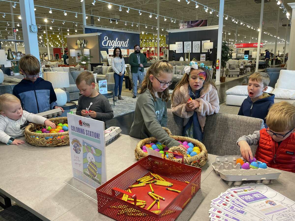 A group of kids at the coloring station at Kloss Furniture during the ECM Eggstravaganza on Saturday.