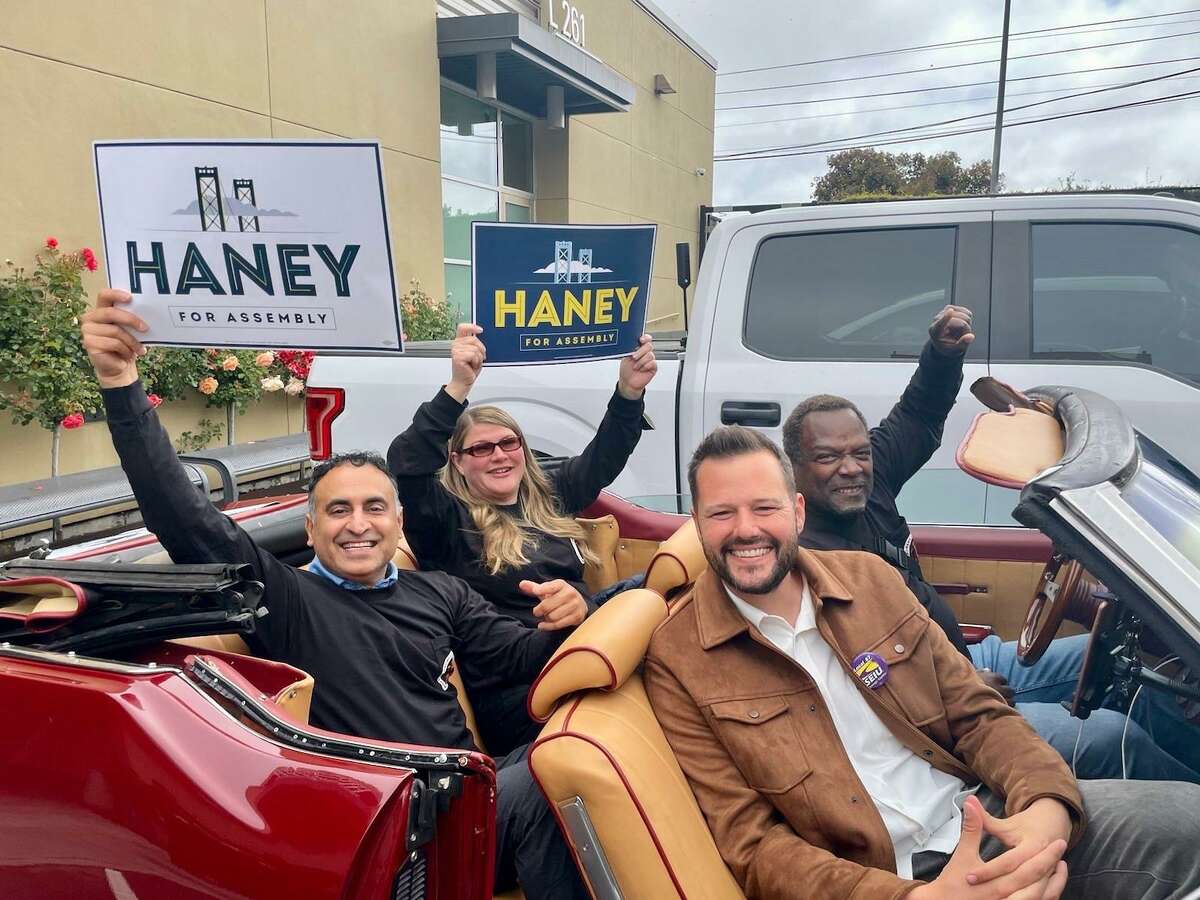 Matt Haney sits with Reggie Daniels, Assembly Member Ash Kalra and Assembly Member Tasha Boerner Horvath during a get-out-the-vote effort Saturday.
