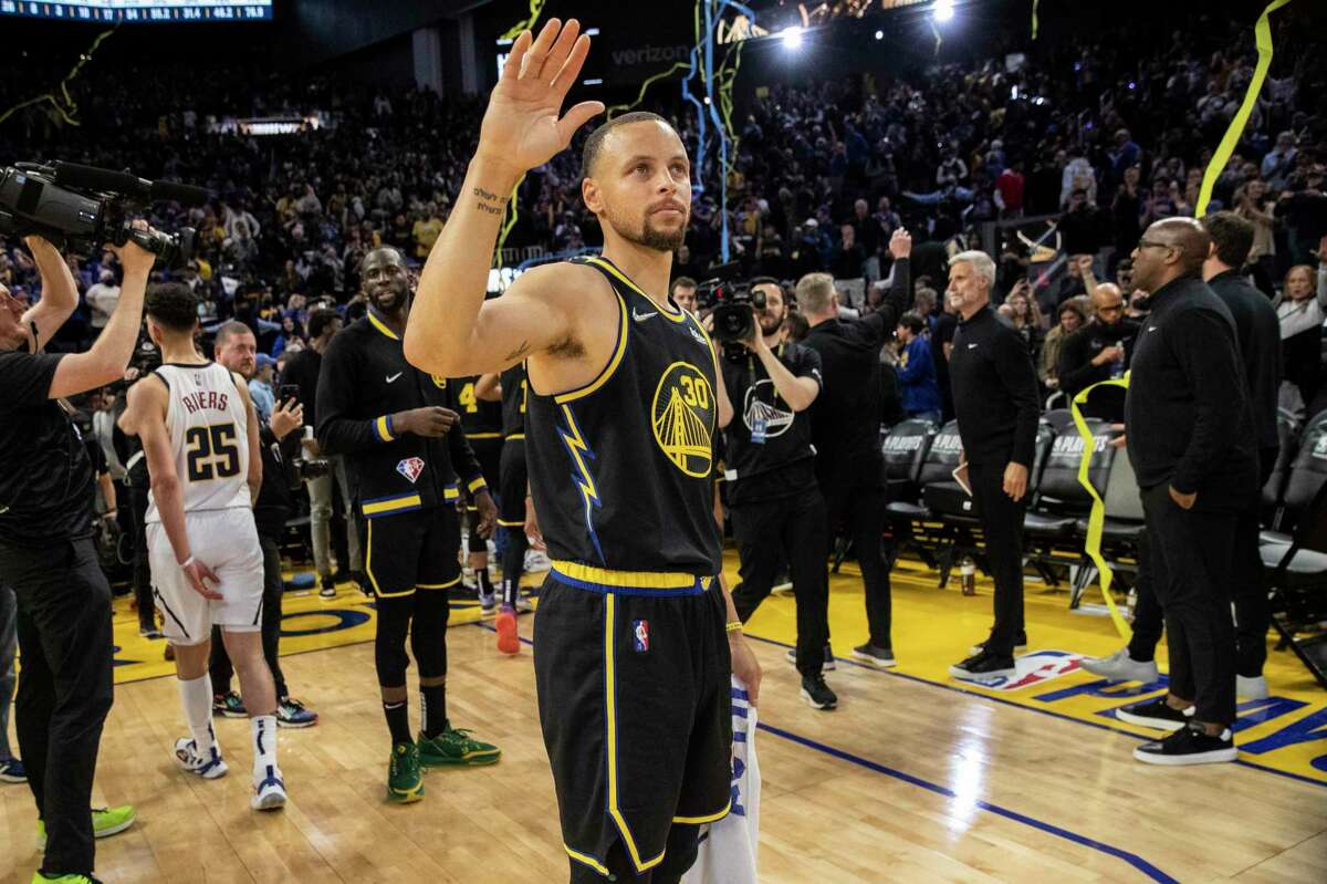 Golden State Warriors guard Stephen Curry waves to the crowd after defeating the Denver Nuggets 123-107 in Game 1 of a NBA basketball first-round playoff series in San Francisco, Calif. Saturday, April 16, 2022.