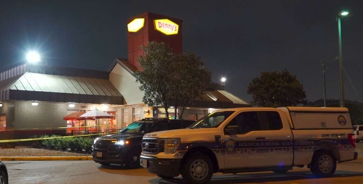 Police at the scene of a Denny's in the 6900 block of Gulf Freeway, where a man was killed by his ex-girlfriend's new boyfriend Apr. 17, 2022. 