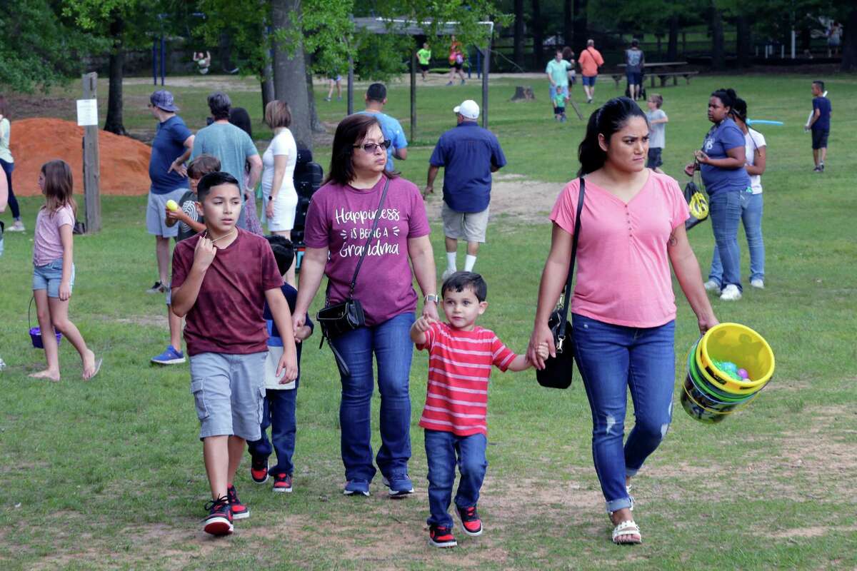 Attendants walk the grounds during the 17th Annual 7 Acre Wood Easter Egg Hunt and Vendor Market Saturday, April 16, 2022 in Conroe, TX.