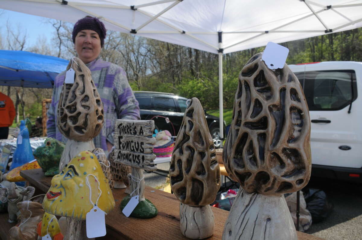 Debbie Clark of Caseyville sells morel mushroom sculptures during Saturday's Mushroom Hunt at Raging Rivers in Grafton.