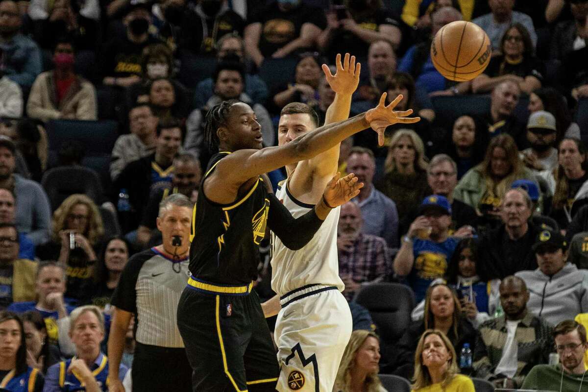 Golden State Warriors' forward Jonathan Kuminga makes a pass during the fourth quarter of Game 1 of a NBA first-round playoff series against the Denver Nuggets in San Francisco, Calif. Saturday, April 16, 2022.