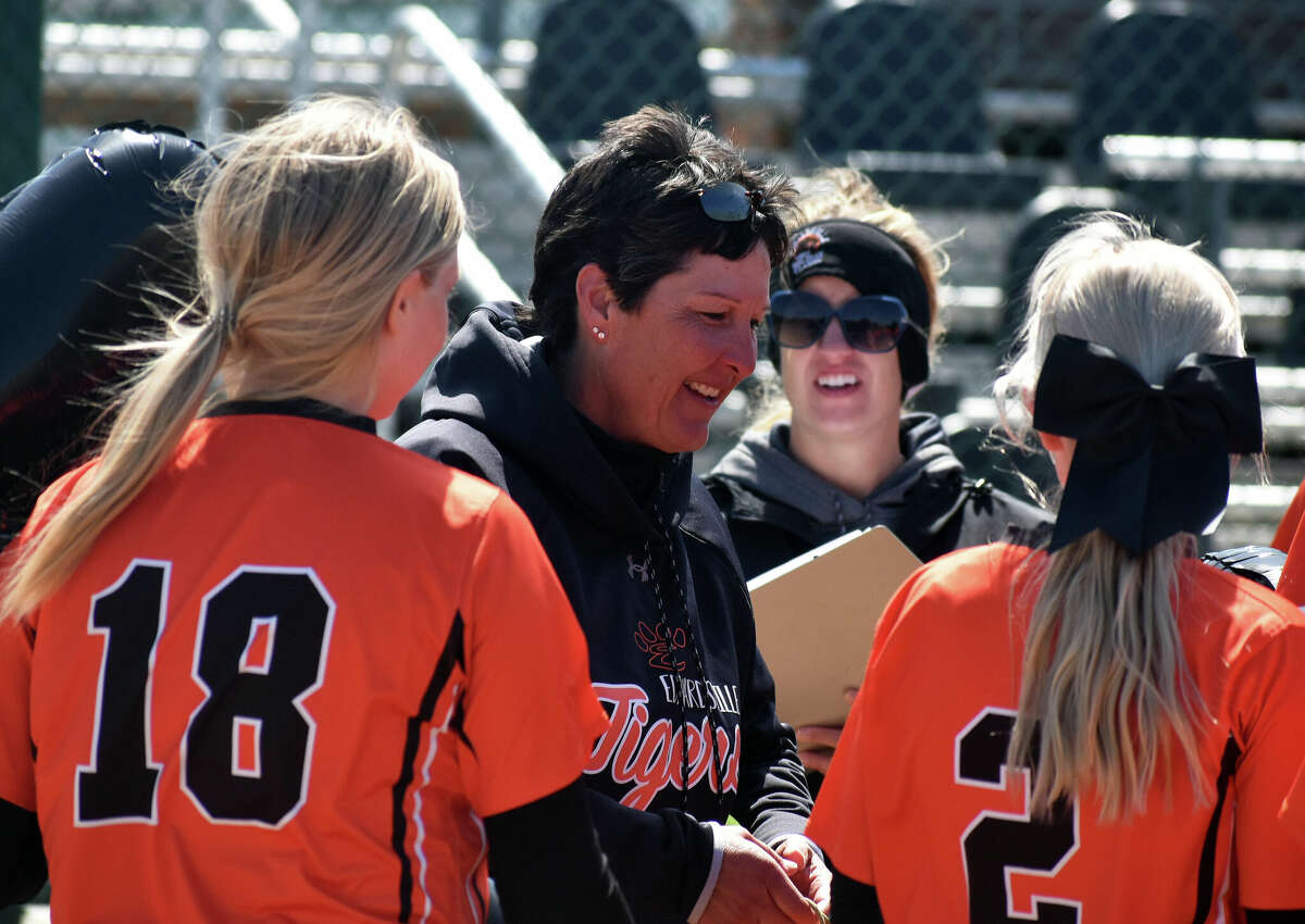 Edwardsville coach Lori Blade is congratulated by her players after earning her 500th win at the school on Saturday inside the District 7 Sports Complex in Edwardsville.