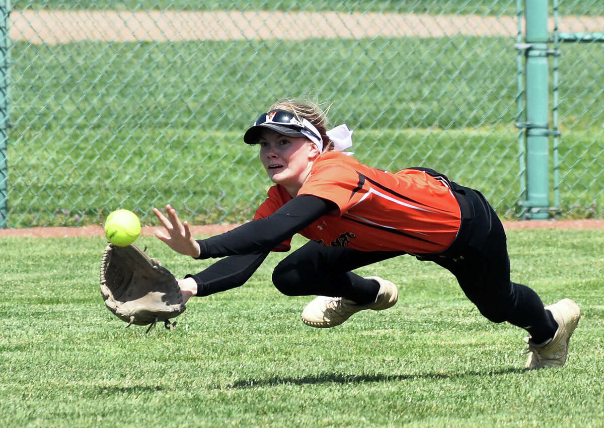 Edwardsville's Ryleigh Owens makes a diving catch in left against Chatham Glenwood on Saturday inside the District 7 Sports Complex in Edwardsville.