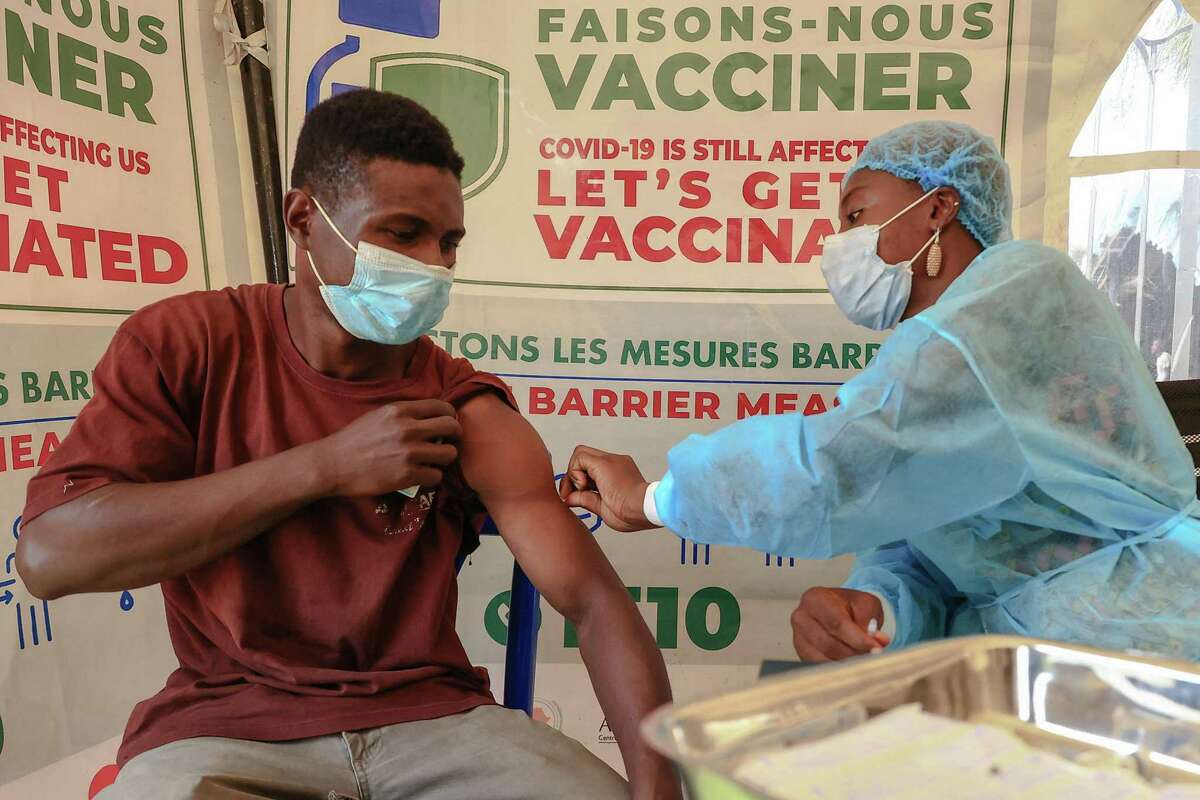 A nurse prepares a COVID-19 vaccine at the Palais des Sports vaccination centre in Yaounde, Camaroon, in January.