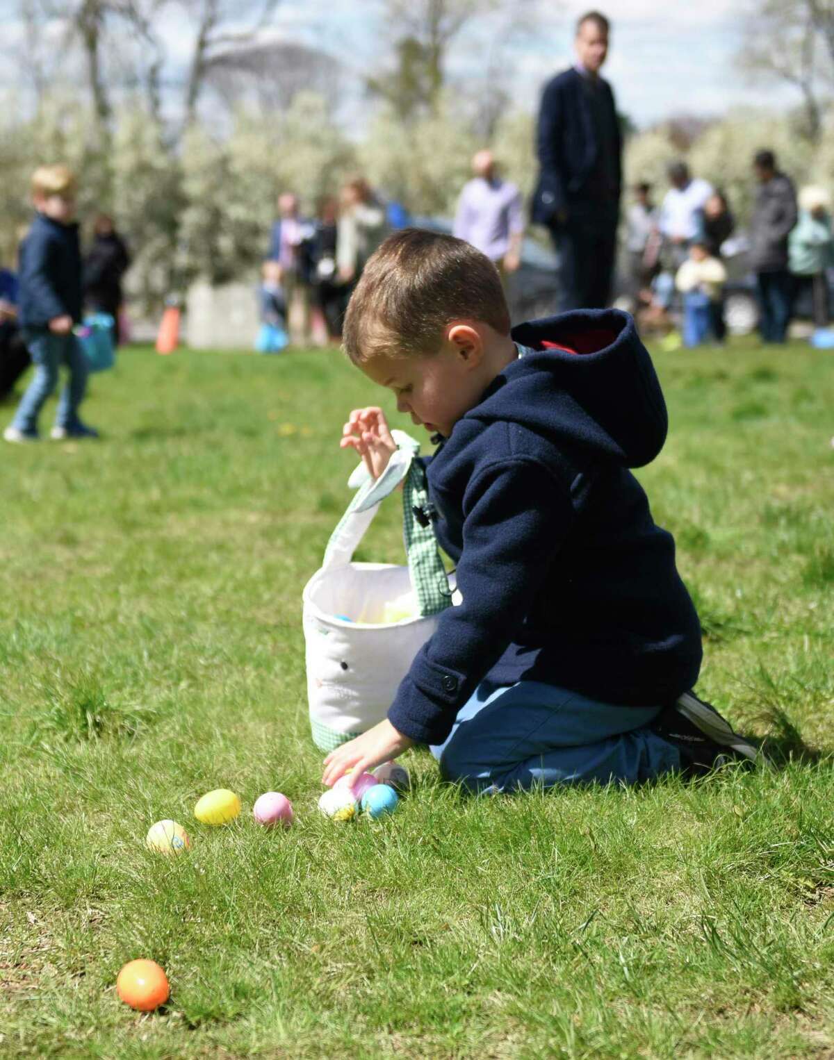 Greenwich's Boyd Butcher, 4, hunts for Easter eggs at Second Congregational Church in Greenwich, Conn. Sunday, April 17, 2022. Following Easter services, children set out to hunt for candy-filled Easter eggs on the church lawn. There were also live bunnies and goats on hand for kids to pet.