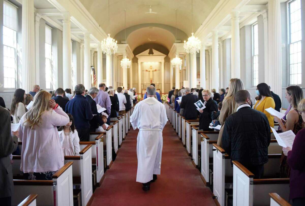 The Rev. Dr. Duane Pederson leads Easter Sunday Mass at St. John's Lutheran Church in Stamford, Conn. Sunday, April 17, 2022. Christians celebrated the resurrection of Jesus Christ with a variety of different Easter services, including sunrise and outdoor services, throughout town.