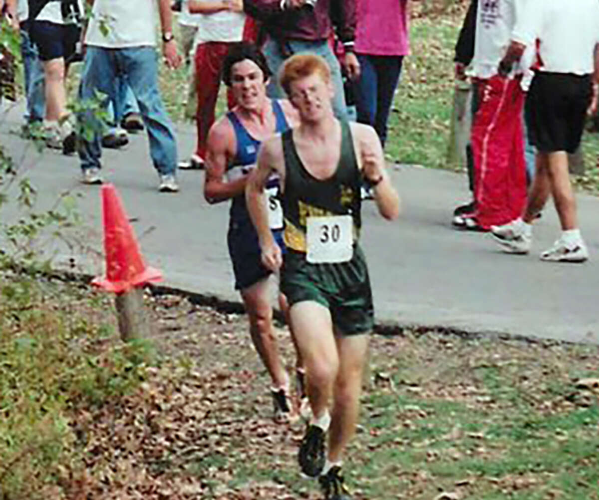 Metro-East Lutheran’s Kent Wories, right, is on his way to a first-place finish in the Class A Benton Sectional during his senior season in 2003.
