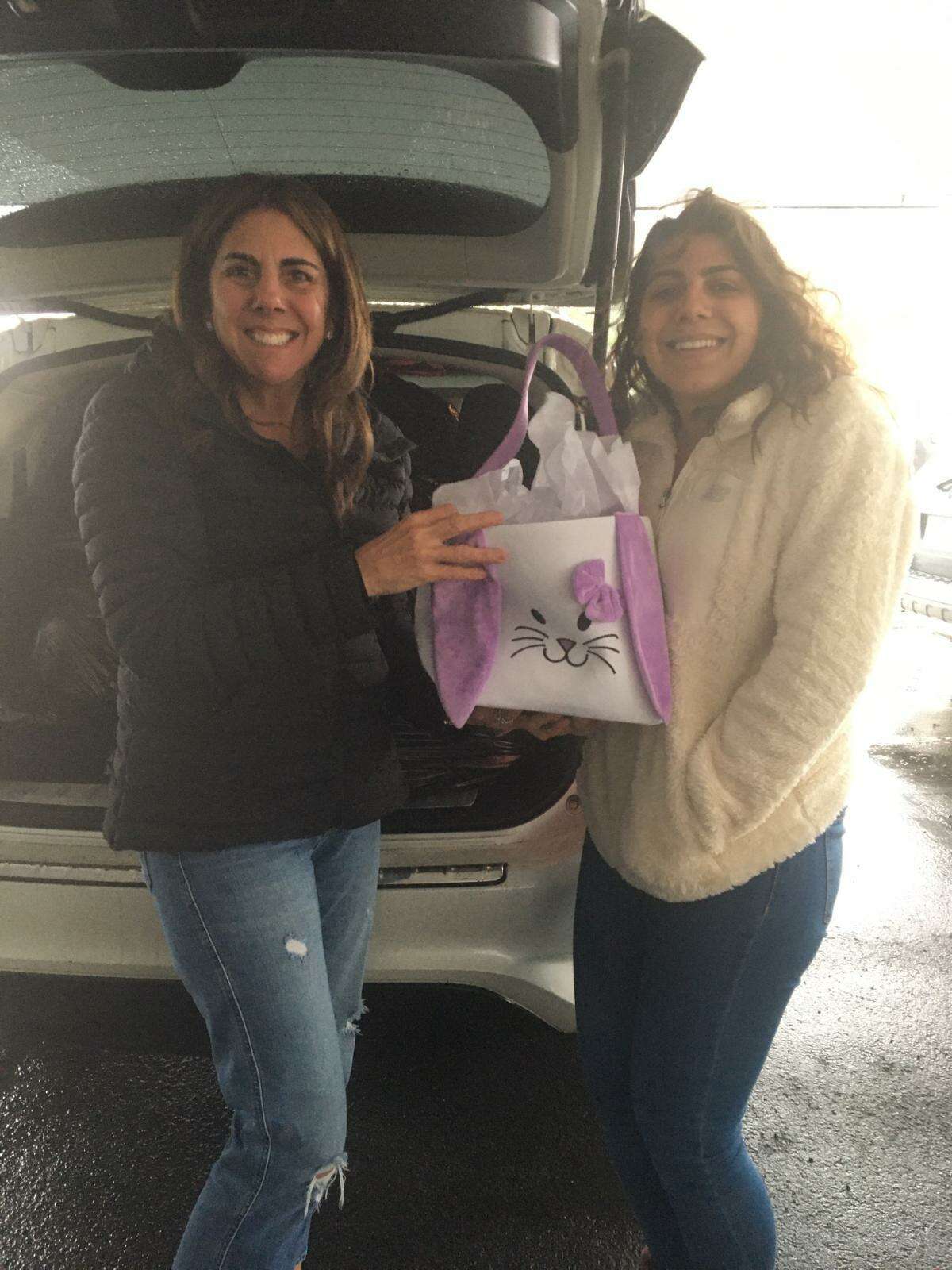 Jessica DiMatteo, right, and her mother, Kim DiMatteo, delivered 94 baskets of goodwill and goodies to three shelters in Norwalk and Stamford. This annual tradition was started more than 21 years ago by the DiMatteo family.