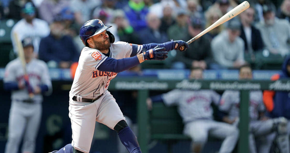 Houston Astros' Jose Altuve strikes out swinging during the eighth inning of a baseball game against the Seattle Mariners, Sunday, April 17, 2022, in Seattle. The Mariners won 7-2. (AP Photo/Ted S. Warren)