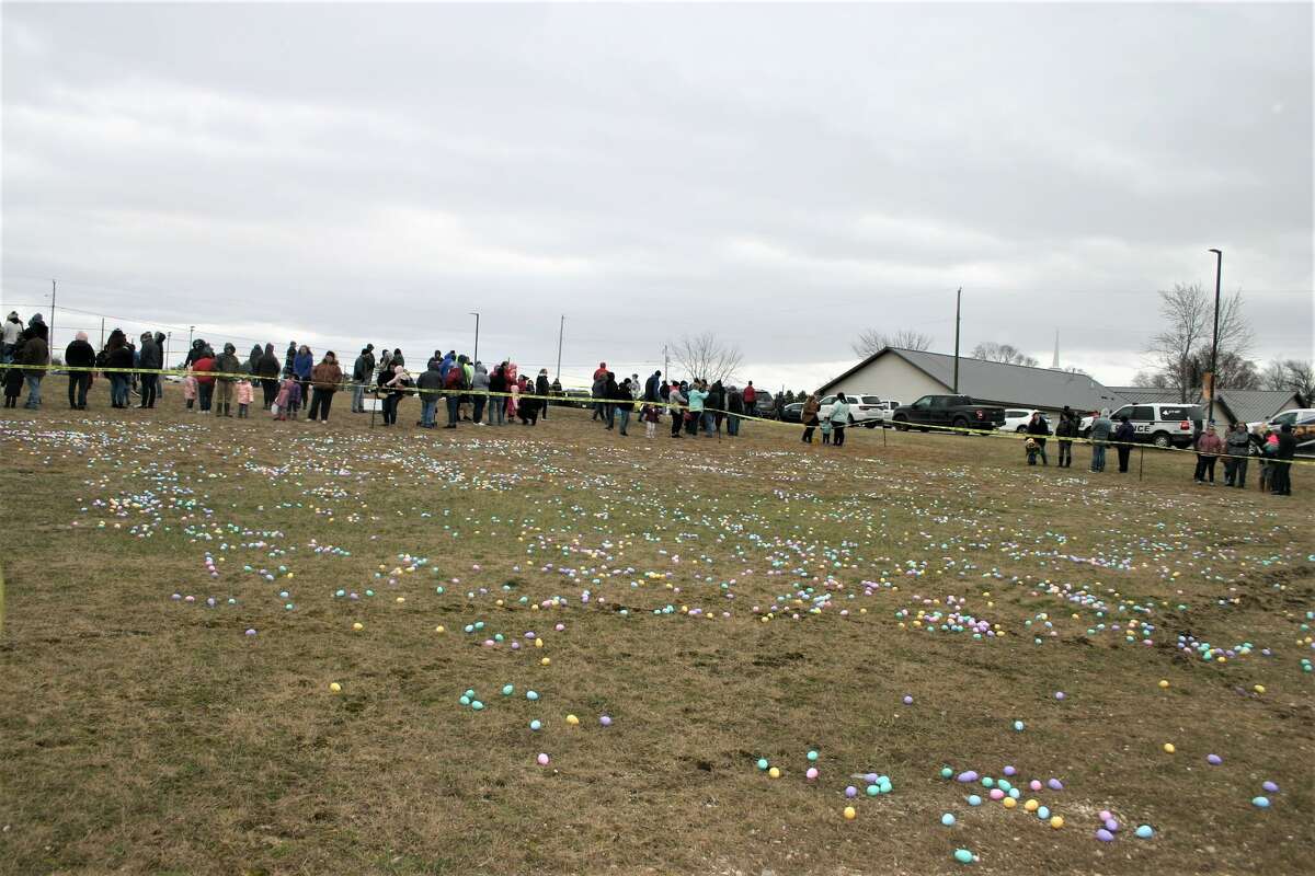 Cold, wind and even a little snow didn't keep the crowds from descending on the Evart High School grounds for the annual Easter Egg Drop. Weather prevented the helicopter from dropping eggs, but that didn't dampen the spirt as kids of all ages scrambled to collect thousands of candy-filled eggs scattered about the ground.