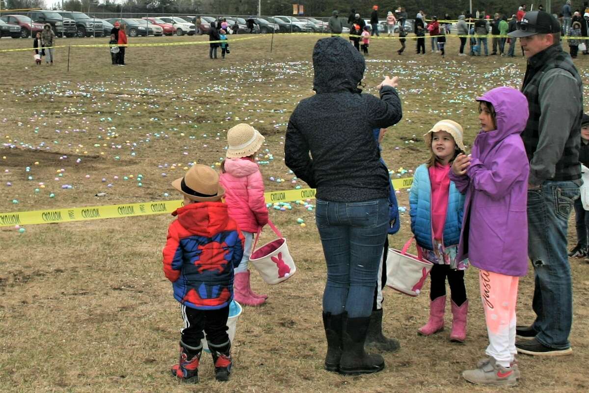Cold, wind and even a little snow didn't keep the crowds from descending on the Evart High School grounds for the annual Easter Egg Drop. Weather prevented the helicopter from dropping eggs, but that didn't dampen the spirt as kids of all ages scrambled to collect thousands of candy-filled eggs scattered about the ground.