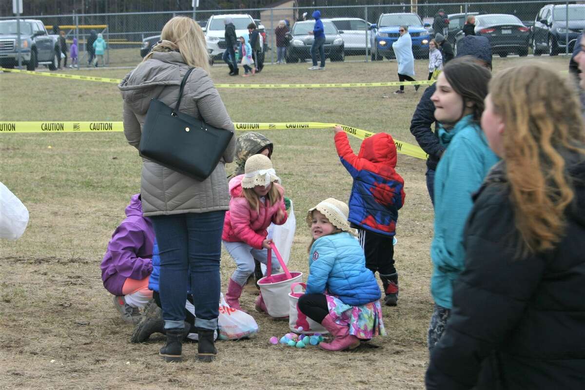 Cold, wind and even a little snow didn't keep the crowds from descending on the Evart High School grounds for the annual Easter Egg Drop. Weather prevented the helicopter from dropping eggs, but that didn't dampen the spirt as kids of all ages scrambled to collect thousands of candy-filled eggs scattered about the ground.