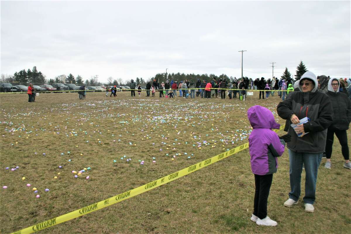 Cold, wind and even a little snow didn't keep the crowds from descending on the Evart High School grounds for the annual Easter Egg Drop. Weather prevented the helicopter from dropping eggs, but that didn't dampen the spirt as kids of all ages scrambled to collect thousands of candy-filled eggs scattered about the ground.
