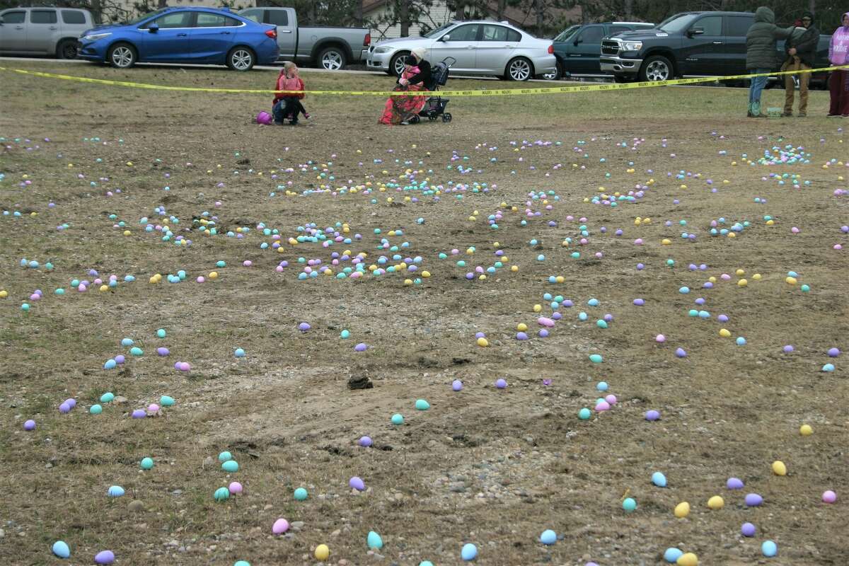Cold, wind and even a little snow didn't keep the crowds from descending on the Evart High School grounds for the annual Easter Egg Drop. Weather prevented the helicopter from dropping eggs, but that didn't dampen the spirt as kids of all ages scrambled to collect thousands of candy-filled eggs scattered about the ground.