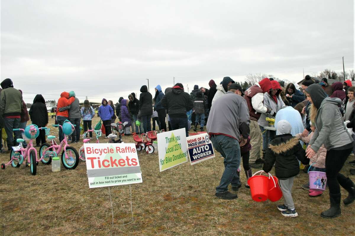 Cold, wind and even a little snow didn't keep the crowds from descending on the Evart High School grounds for the annual Easter Egg Drop. Weather prevented the helicopter from dropping eggs, but that didn't dampen the spirt as kids of all ages scrambled to collect thousands of candy-filled eggs scattered about the ground.