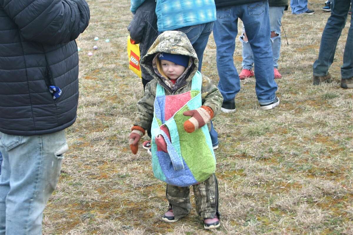 Cold, wind and even a little snow didn't keep the crowds from descending on the Evart High School grounds for the annual Easter Egg Drop. Weather prevented the helicopter from dropping eggs, but that didn't dampen the spirt as kids of all ages scrambled to collect thousands of candy-filled eggs scattered about the ground.