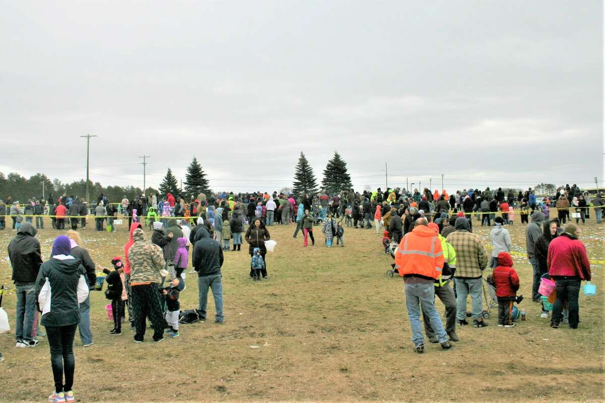 Cold, wind and even a little snow didn't keep the crowds from descending on the Evart High School grounds for the annual Easter Egg Drop. Weather prevented the helicopter from dropping eggs, but that didn't dampen the spirt as kids of all ages scrambled to collect thousands of candy-filled eggs scattered about the ground.
