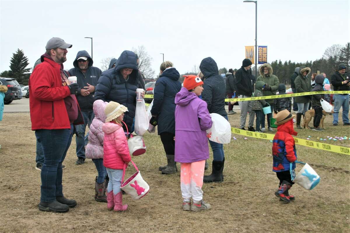 Cold, wind and even a little snow didn't keep the crowds from descending on the Evart High School grounds for the annual Easter Egg Drop. Weather prevented the helicopter from dropping eggs, but that didn't dampen the spirt as kids of all ages scrambled to collect thousands of candy-filled eggs scattered about the ground.
