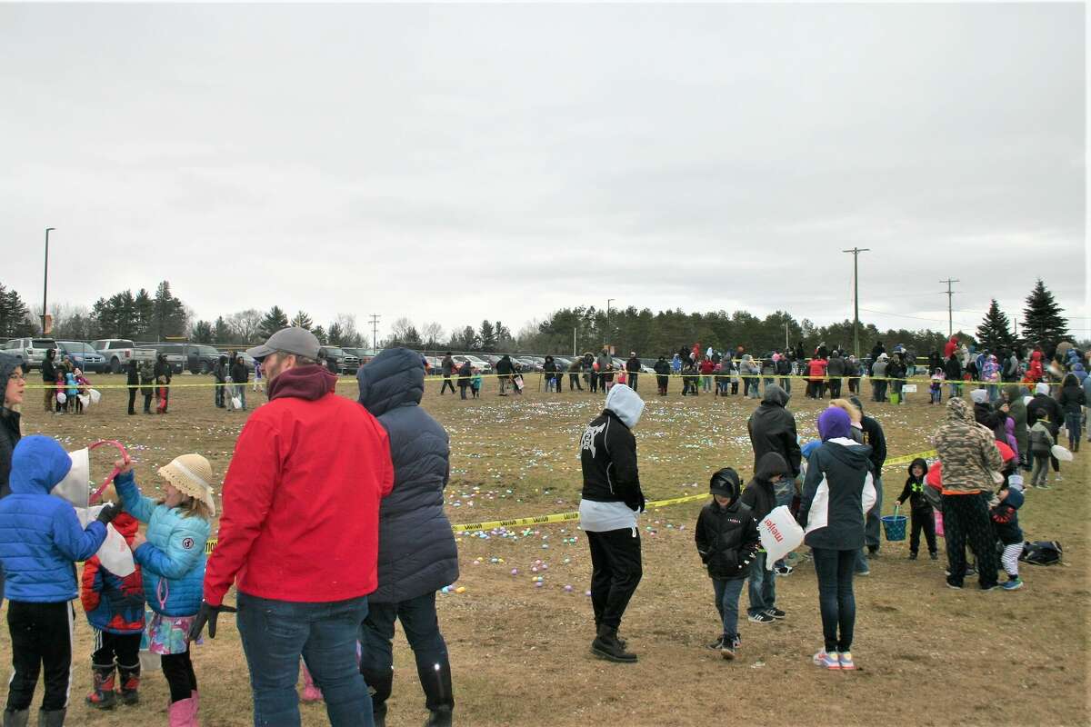 Cold, wind and even a little snow didn't keep the crowds from descending on the Evart High School grounds for the annual Easter Egg Drop. Weather prevented the helicopter from dropping eggs, but that didn't dampen the spirt as kids of all ages scrambled to collect thousands of candy-filled eggs scattered about the ground.