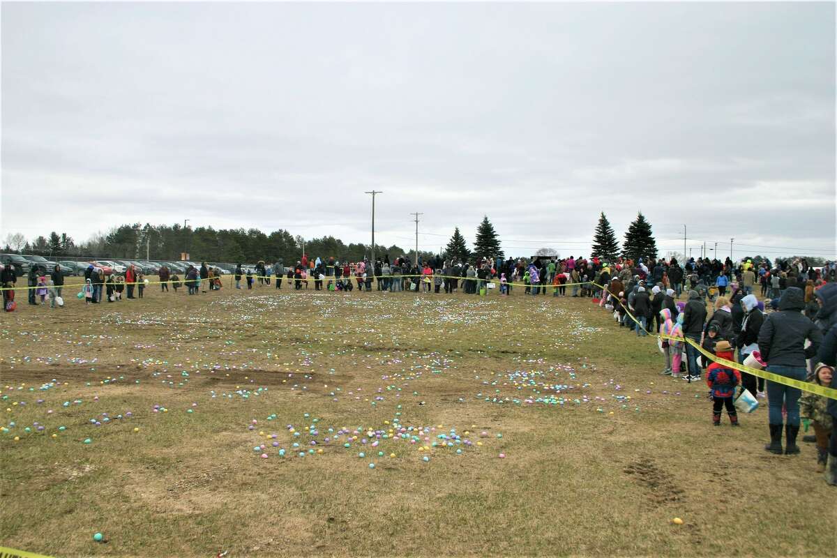 Cold, wind and even a little snow didn't keep the crowds from descending on the Evart High School grounds for the annual Easter Egg Drop. Weather prevented the helicopter from dropping eggs, but that didn't dampen the spirt as kids of all ages scrambled to collect thousands of candy-filled eggs scattered about the ground.