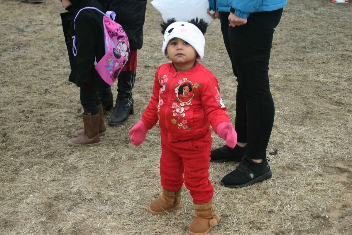 Cold, wind and even a little snow didn't keep the crowds from descending on the Evart High School grounds for the annual Easter Egg Drop. Weather prevented the helicopter from dropping eggs, but that didn't dampen the spirt as kids of all ages scrambled to collect thousands of candy-filled eggs scattered about the ground.