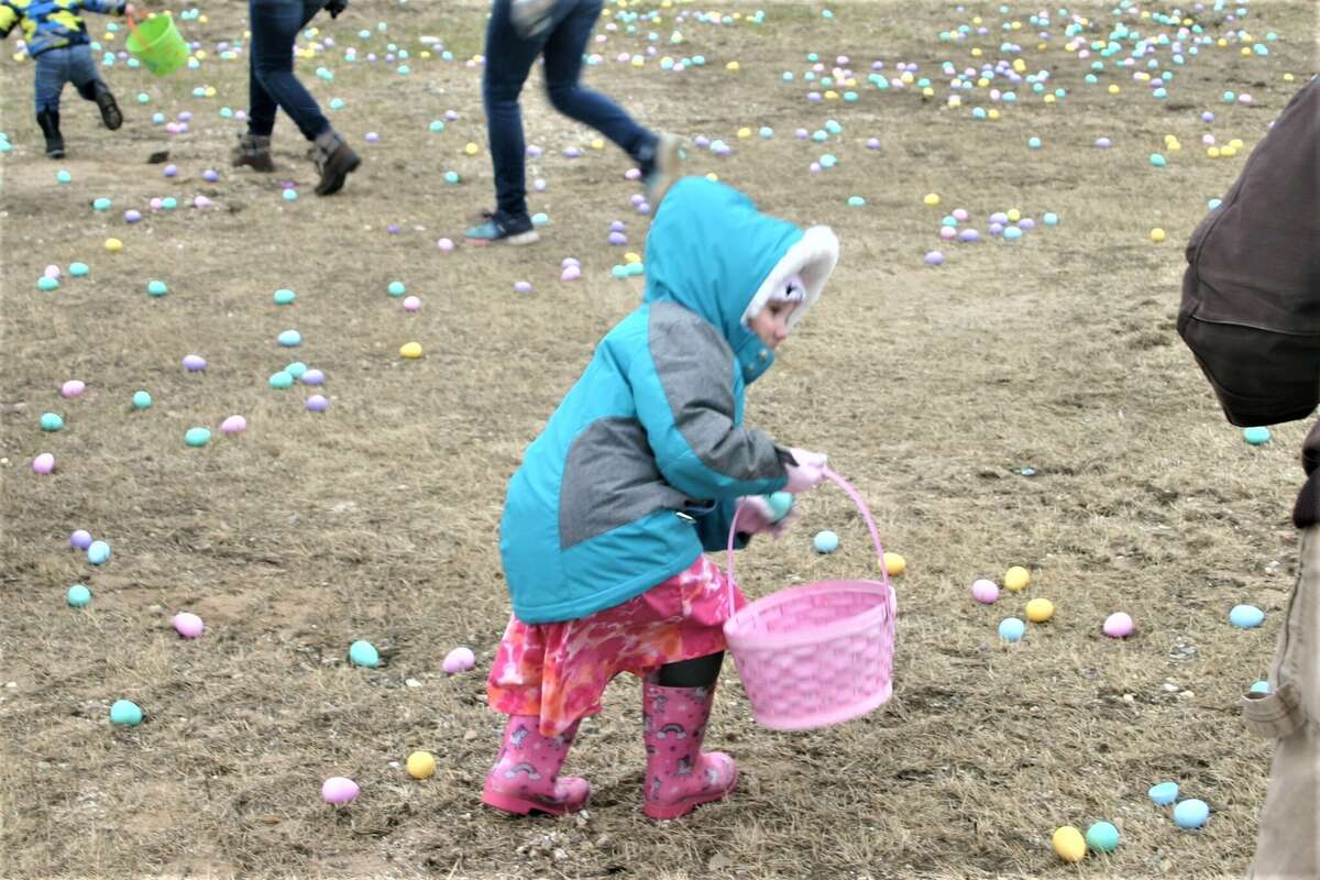 Cold, wind and even a little snow didn't keep the crowds from descending on the Evart High School grounds for the annual Easter Egg Drop. Weather prevented the helicopter from dropping eggs, but that didn't dampen the spirt as kids of all ages scrambled to collect thousands of candy-filled eggs scattered about the ground.