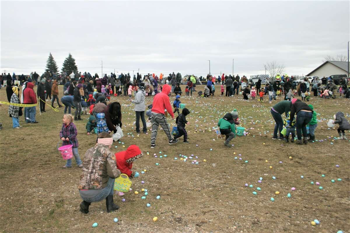 Cold, wind and even a little snow didn't keep the crowds from descending on the Evart High School grounds for the annual Easter Egg Drop. Weather prevented the helicopter from dropping eggs, but that didn't dampen the spirt as kids of all ages scrambled to collect thousands of candy-filled eggs scattered about the ground.