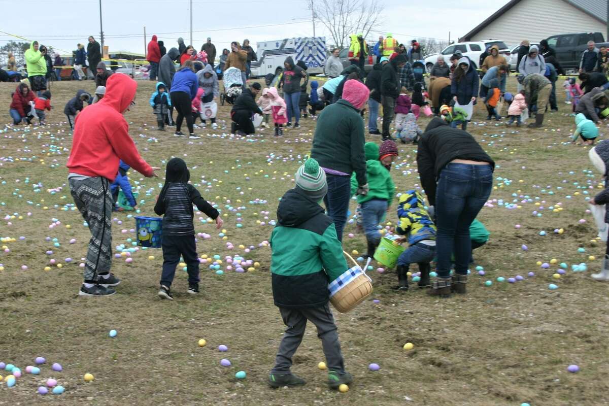 Cold, wind and even a little snow didn't keep the crowds from descending on the Evart High School grounds for the annual Easter Egg Drop. Weather prevented the helicopter from dropping eggs, but that didn't dampen the spirt as kids of all ages scrambled to collect thousands of candy-filled eggs scattered about the ground.
