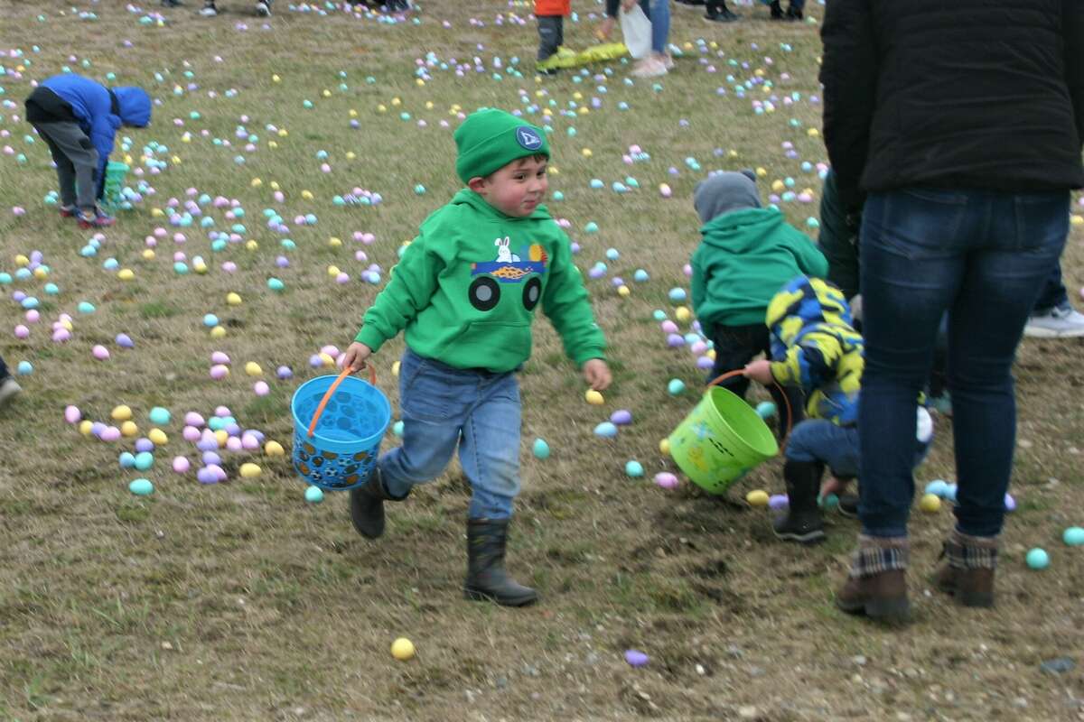 Cold, wind and even a little snow didn't keep the crowds from descending on the Evart High School grounds for the annual Easter Egg Drop. Weather prevented the helicopter from dropping eggs, but that didn't dampen the spirt as kids of all ages scrambled to collect thousands of candy-filled eggs scattered about the ground.