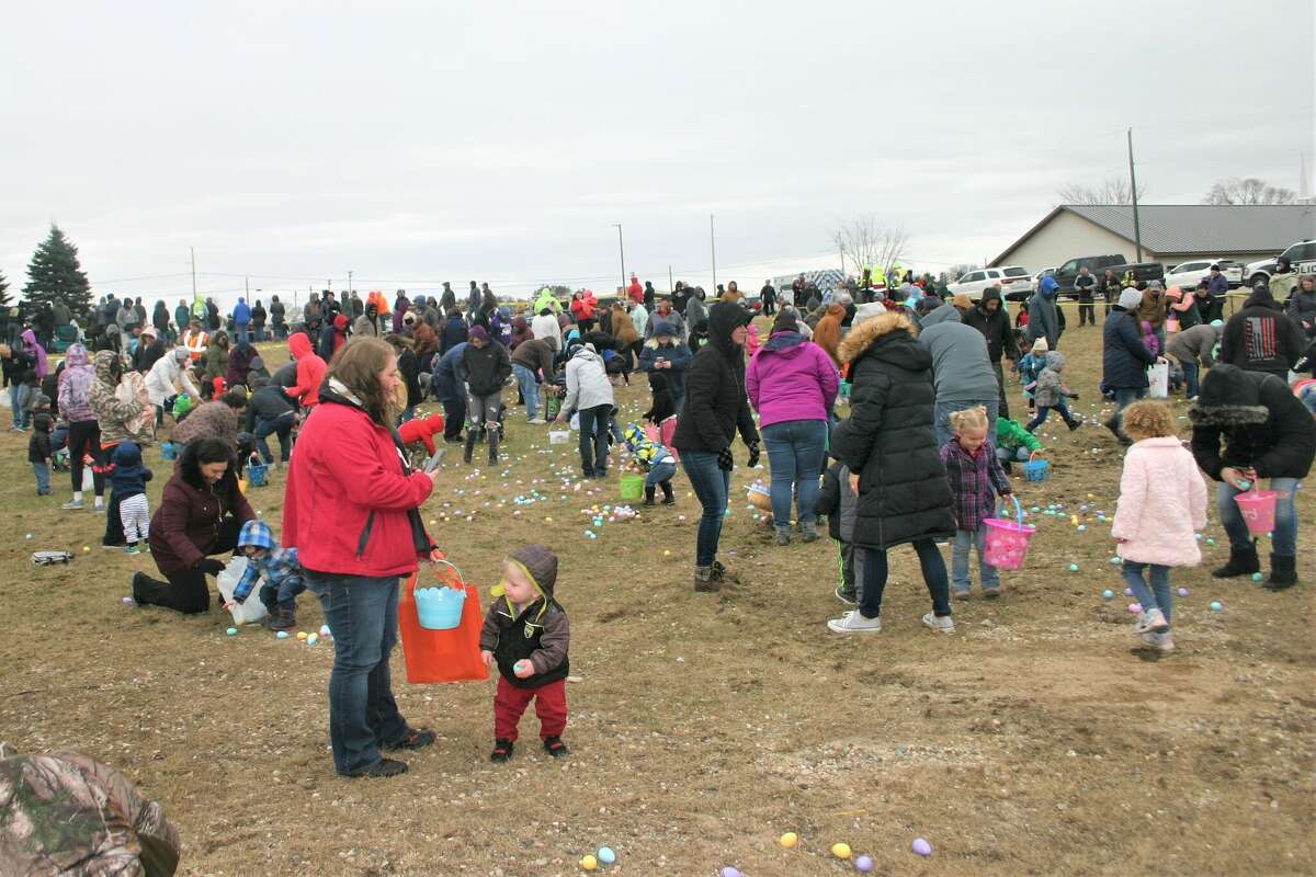 Cold, wind and even a little snow didn't keep the crowds from descending on the Evart High School grounds for the annual Easter Egg Drop. Weather prevented the helicopter from dropping eggs, but that didn't dampen the spirt as kids of all ages scrambled to collect thousands of candy-filled eggs scattered about the ground.